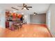Spacious living area featuring wood floors, a kitchen, and island seating at 925 Elm St, Denver, CO 80220