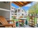 Cozy outdoor balcony with chairs and small table, perfect for relaxing outdoors at 4460 S Pitkin St # 119, Aurora, CO 80015