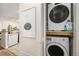 Convenient in-unit laundry area with stacked washer and dryer at 4460 S Pitkin St # 119, Aurora, CO 80015