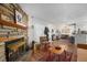 Relaxing living room with stone fireplace, hardwood floors, and comfortable seating at 4460 S Pitkin St # 119, Aurora, CO 80015