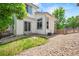 A backyard with a small patch of grass and a partial view of the home at 10681 Cherrybrook Cir, Highlands Ranch, CO 80126