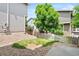 A backyard showing a small grass area fenced in by a wood picket fence at 10681 Cherrybrook Cir, Highlands Ranch, CO 80126