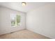 Empty bedroom featuring a window and neutral carpeting at 10681 Cherrybrook Cir, Highlands Ranch, CO 80126
