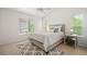 Spacious bedroom features large windows and modern décor at 10681 Cherrybrook Cir, Highlands Ranch, CO 80126