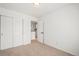 This bedroom boasts neutral carpet and a sizable closet perfect for storage at 10681 Cherrybrook Cir, Highlands Ranch, CO 80126