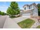 Well-maintained two-story home with a two-car garage, landscaping, and a tidy lawn at 10681 Cherrybrook Cir, Highlands Ranch, CO 80126