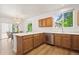 Kitchen featuring stainless appliances, wood cabinets, and breakfast bar at 10681 Cherrybrook Cir, Highlands Ranch, CO 80126