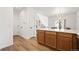 Open kitchen featuring breakfast bar and light wood cabinets at 10681 Cherrybrook Cir, Highlands Ranch, CO 80126