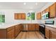 Spacious kitchen with wood cabinets, stainless steel appliances, and white countertops at 10681 Cherrybrook Cir, Highlands Ranch, CO 80126