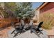 Inviting backyard patio features comfortable seating around a cozy fire pit, perfect for outdoor entertaining at 13360 W 83Rd Pl, Arvada, CO 80005