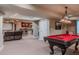 Finished basement featuring a pool table, home theatre, and bar at 13360 W 83Rd Pl, Arvada, CO 80005