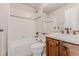 Bathroom featuring a shower-tub combo, vanity, and toilet at 13360 W 83Rd Pl, Arvada, CO 80005