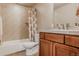 Well-lit bathroom with a shower, bathtub, and single sink vanity at 13360 W 83Rd Pl, Arvada, CO 80005