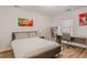 Bedroom with modern bed, desk, bookshelf, and large window at 13360 W 83Rd Pl, Arvada, CO 80005
