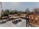 Spacious backyard deck with comfortable outdoor seating and a view of the landscaped yard at 13360 W 83Rd Pl, Arvada, CO 80005