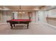 Spacious game room with a billiard table and ample space for entertainment at 13360 W 83Rd Pl, Arvada, CO 80005