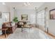 Comfortable living room with hardwood floors, a plush rug, and plenty of natural light at 13360 W 83Rd Pl, Arvada, CO 80005