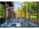 Outdoor seating area offers a relaxing atmosphere with lush greenery and stylish furniture at 13360 W 83Rd Pl, Arvada, CO 80005