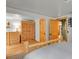 Bright bedroom with wood floors, wood trim, and an armoire at 8905 Carol Ln, Conifer, CO 80433