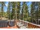 Back deck features a grill and seating at 8905 Carol Ln, Conifer, CO 80433