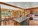 Spacious kitchen area with granite countertops and seamless flow into the dining and living rooms at 8905 Carol Ln, Conifer, CO 80433