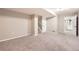 Finished basement with a carpeted staircase and white trim at 14245 Corrine Ct, Broomfield, CO 80023