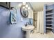 Cozy bathroom featuring a pedestal sink, framed mirror and stand-up shower at 14245 Corrine Ct, Broomfield, CO 80023
