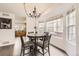 Bright dining area with a stylish chandelier and views into the adjacent kitchen at 14245 Corrine Ct, Broomfield, CO 80023