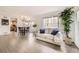 Bright living room with hardwood floors, large windows, and contemporary furnishings at 14245 Corrine Ct, Broomfield, CO 80023