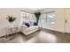 Comfortable living room featuring large windows, hardwood floors, and neutral decor at 14245 Corrine Ct, Broomfield, CO 80023
