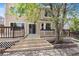 Landscaped backyard featuring a spacious deck with stairs, perfect for outdoor living and entertaining guests at 17519 E Caspian Pl, Aurora, CO 80013
