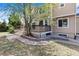 Lovely backyard with a wooden deck and brick-lined landscaping, an inviting space for relaxation and gardening at 17519 E Caspian Pl, Aurora, CO 80013