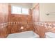 Bathroom with marble-like tiled walls and tub shower at 17519 E Caspian Pl, Aurora, CO 80013
