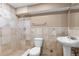 Tile bathroom with shower, sink, and toilet at 17519 E Caspian Pl, Aurora, CO 80013