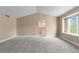 Spacious bedroom featuring vaulted ceiling, large window, and ensuite bathroom access, creating a private oasis at 17519 E Caspian Pl, Aurora, CO 80013