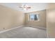 Bright and spacious bedroom with large window, neutral walls, and ceiling fan for added comfort at 17519 E Caspian Pl, Aurora, CO 80013
