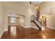Open living room with hardwood floors and a staircase, creating a spacious and airy atmosphere at 17519 E Caspian Pl, Aurora, CO 80013
