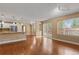 Inviting living room with hardwood floors, natural light, and seamless flow to the updated kitchen at 17519 E Caspian Pl, Aurora, CO 80013