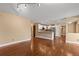 Open-concept living space with hardwood floors, connecting to a kitchen with stainless steel appliances at 17519 E Caspian Pl, Aurora, CO 80013