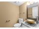 Stylish powder room with granite countertop, vessel sink, and modern fixtures, conveniently located on main level at 17519 E Caspian Pl, Aurora, CO 80013
