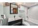 Modern bathroom with sleek vanity, decorative lighting, and a combined shower-tub, creating a tranquil space at 1551 Larimer St # 1901, Denver, CO 80202