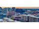 View of a dense urban landscape with a variety of buildings including a sign that says, 