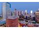 Cityscape during the blue hour displaying many buildings and towers against the dark blue sky at 1551 Larimer St # 1901, Denver, CO 80202