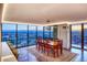 Bright dining area featuring floor-to-ceiling windows with stunning city views and contemporary lighting at 1551 Larimer St # 1901, Denver, CO 80202