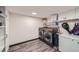 Functional laundry room with modern washer and dryer, and ample storage for cleaning supplies at 1551 Larimer St # 1901, Denver, CO 80202