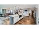 Modern, open floor plan featuring an island kitchen, dining area, and living room with fireplace and balcony at 1551 Larimer St # 1901, Denver, CO 80202