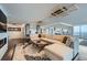Expansive living room with city views, modern lighting, and a wet bar for entertaining at 1551 Larimer St # 1901, Denver, CO 80202