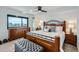 Comfortable main bedroom with a large bed, stylish furnishings, and a window offering city views at 1551 Larimer St # 1901, Denver, CO 80202