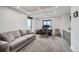 Bright home office featuring coffered ceilings, a comfortable couch, and a functional workspace at 1551 Larimer St # 1901, Denver, CO 80202