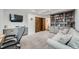 Cozy office space with a built-in bookcase and TV, perfect for productivity and relaxation at 1551 Larimer St # 1901, Denver, CO 80202